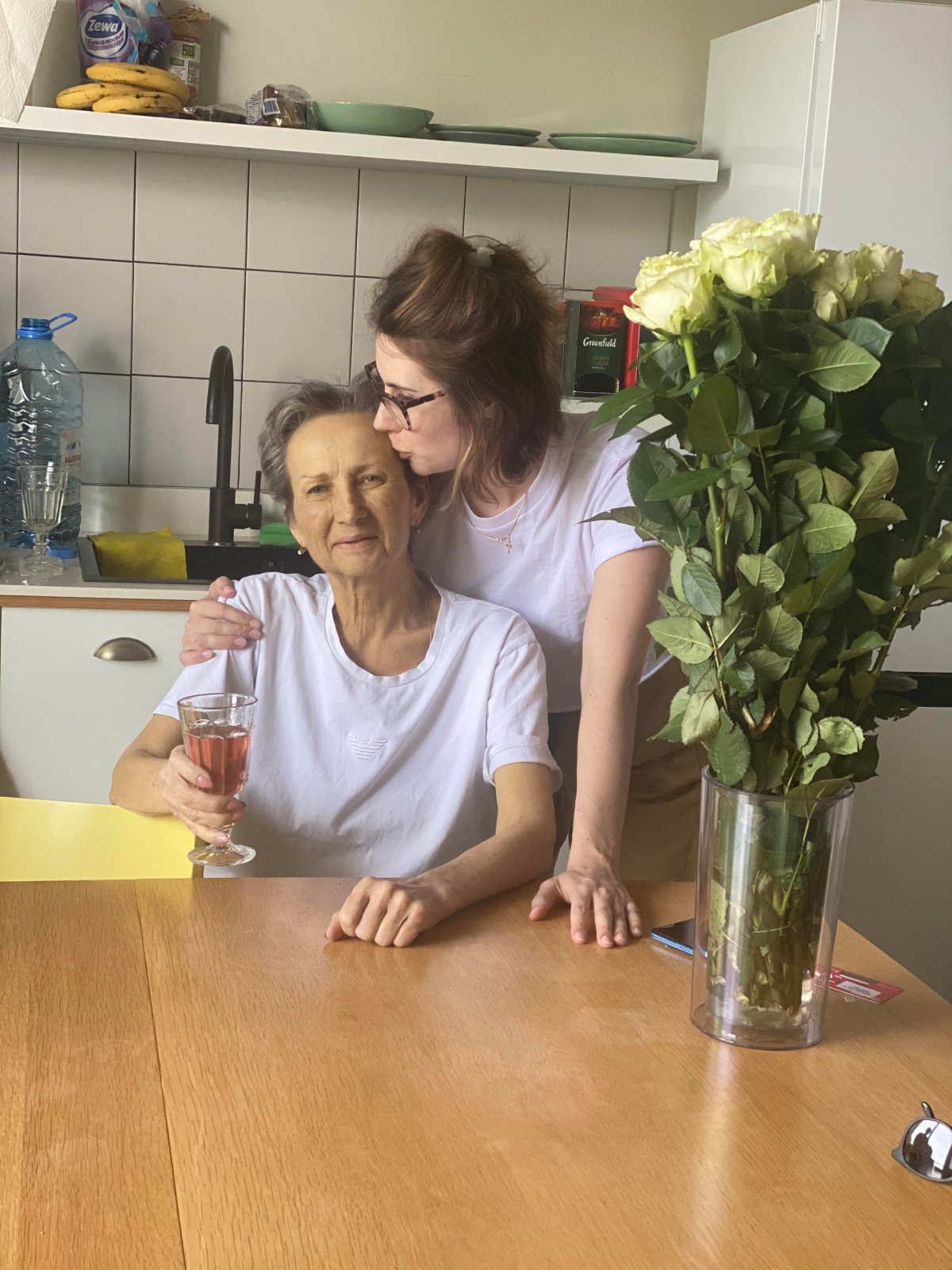 Kateryna, left, and Iryna Kuznetsova with the roses the daughter got for her mother. 