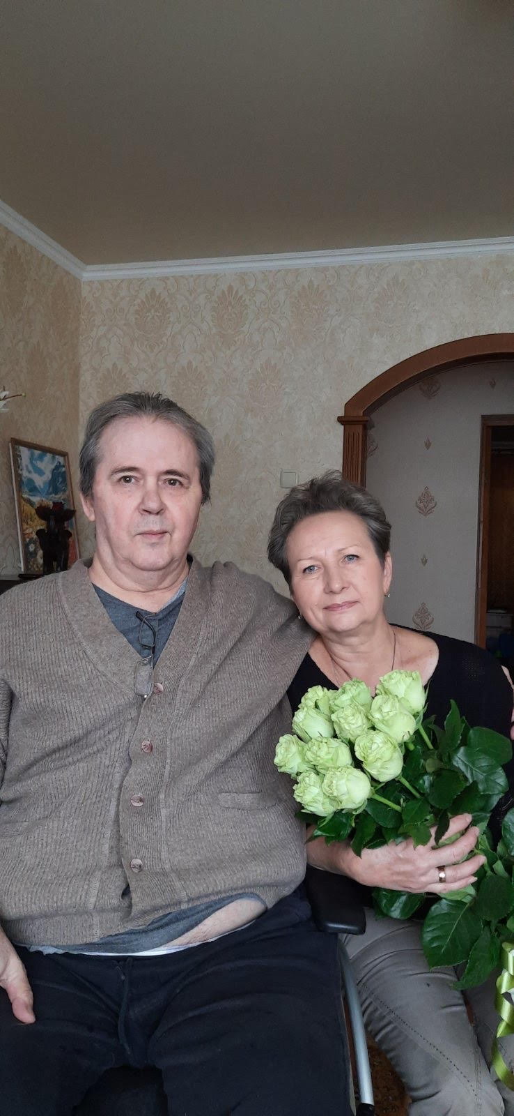 Oleksandr and Kateryna Kuznetsova, holding a bouquet of roses, as seen in a picture sent by Iryna's brother.