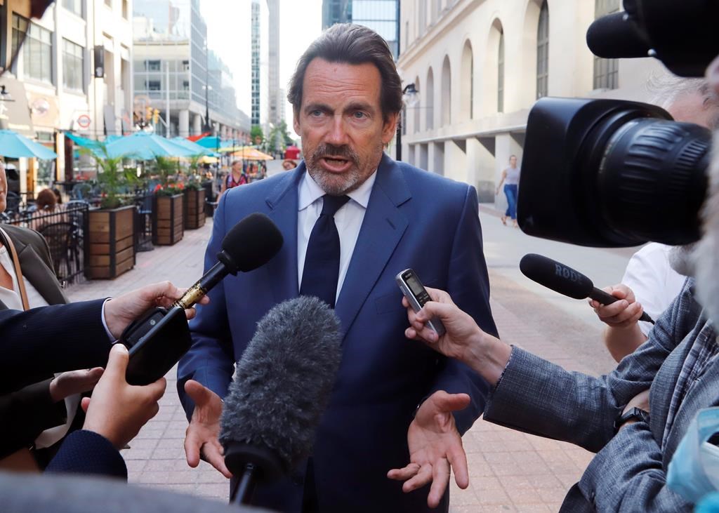 Pierre Karl Peladeau, president and CEO of Quebecor, speaks with reporters in Ottawa on May 31, 2022. 