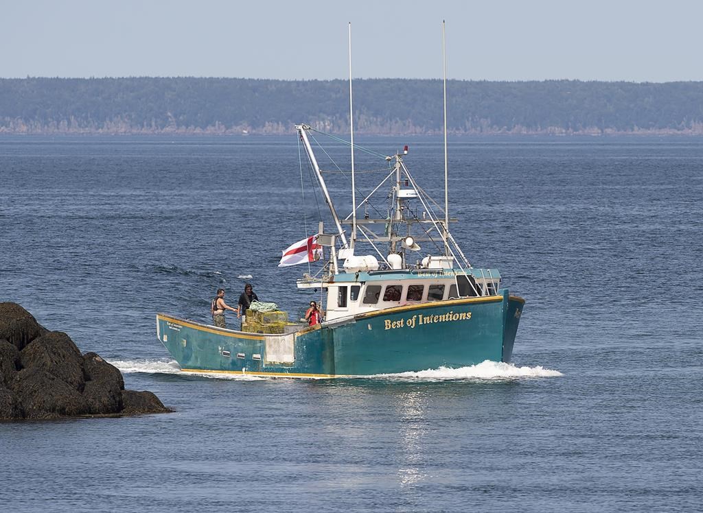 A fishing boat from the Sipekne'katik First Nation prepares for the start of its self-regulated treaty lobster fishery in Saulnierville, N.S. on Monday, Aug.16, 2021. Three years after a First Nation in Nova Scotia started a self-regulated lobster fishery that sparked protests and violence, federal prosecutors are pushing ahead with court cases against dozens of Indigenous fishers, some of whom are sure to launch constitutional challenges. THE CANADIAN PRESS/Andrew Vaughan.
