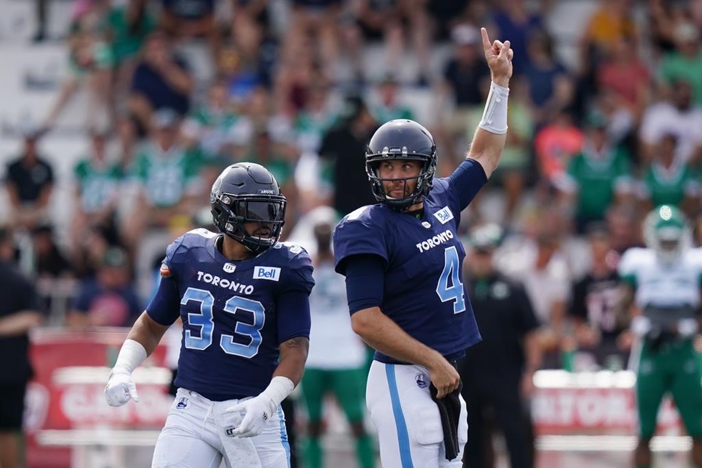 Toronto Argonauts’ quarterback McLeod Bethel-Thompson, right, signals a call in front of teammate Andrew Harris looks to pass during the first half of CFL action against the Saskatchewan Roughriders at Acadia University in Wolfville, N.S., Saturday, July 16, 2022. THE CANADIAN PRESS/Darren Calabrese