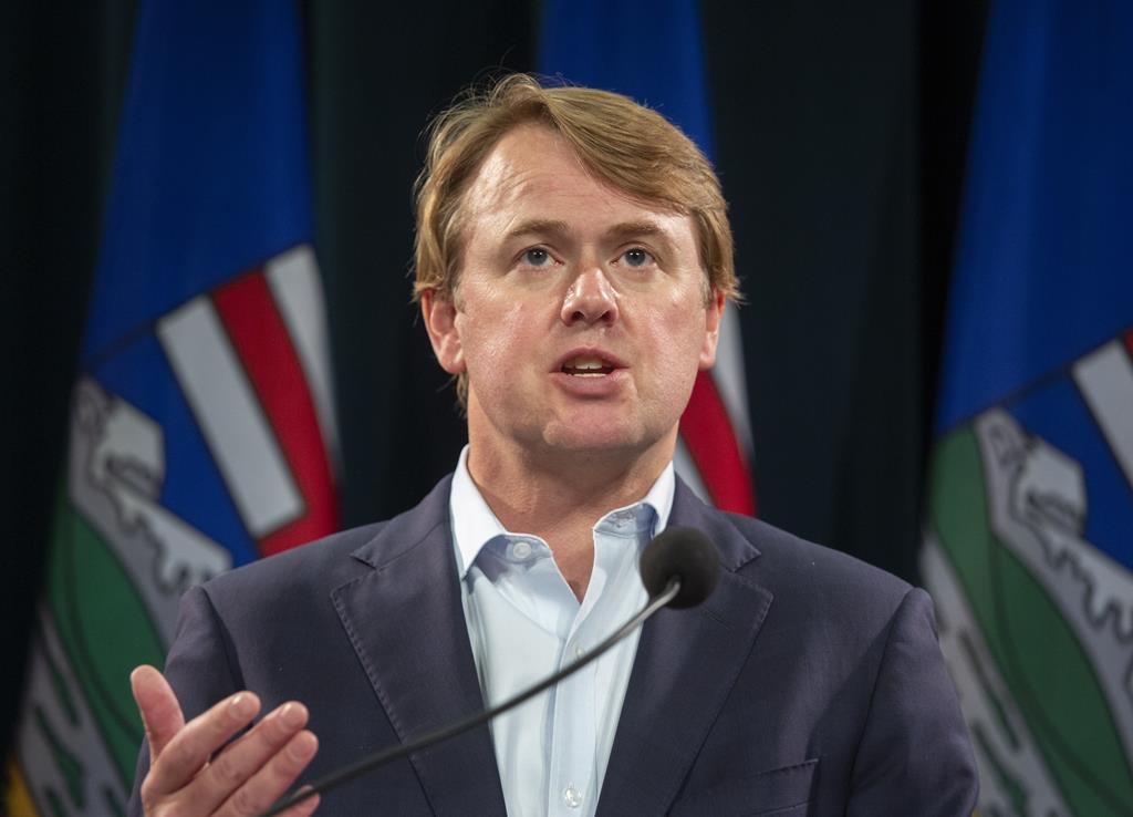 Tyler Shandro answers questions at a news conference, in Calgary, Alta., Friday, Sept. 3, 2021. The United Conservative government is expanding its chief firearms office as part of its efforts to process administrative tasks faster in the province. THE CANADIAN PRESS/Todd Korol.
