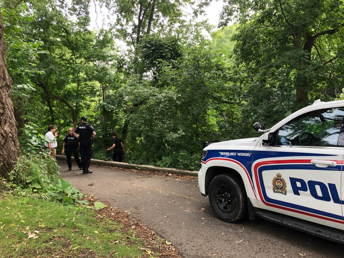 London police stationed along the Thames Valley Parkway near Ivey Park following the discovery of a body in the Thames River.