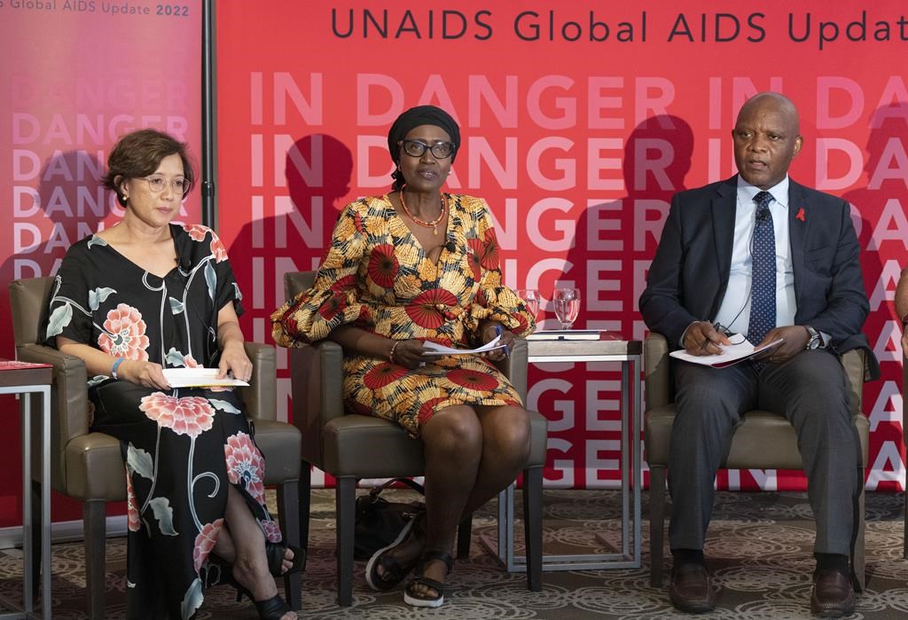 Winnie Byanyima, executive director of UNAIDS, (centre), releases the 2022 update on the global AIDS situation, as Adeeba Kamarulzaman, president of the International AIDS Society, (left), and John Nkengasong, U.S. Global AIDS Coordinator, (right), look on at a news conference Wednesday, July 27, 2022, in Montreal. The world AIDS conference begins here this weekend. THE CANADIAN PRESS/Ryan Remiorz.