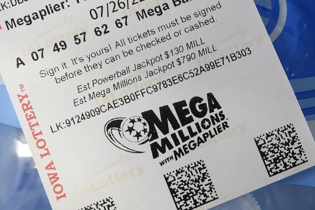 A Mega Millions lottery ticket is seen in a local grocery store, Monday, July 25, 2022, in Des Moines, Iowa.