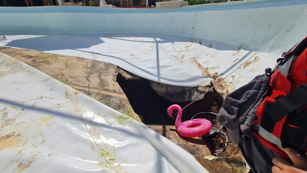 The sinkhole that opened underneath an in-ground pool in Israel on Thursday.