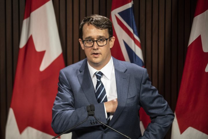 Ontario Labour Minister Monte McNaughton takes to the podium during a news conference in Toronto on Wednesday, April 28, 2021.