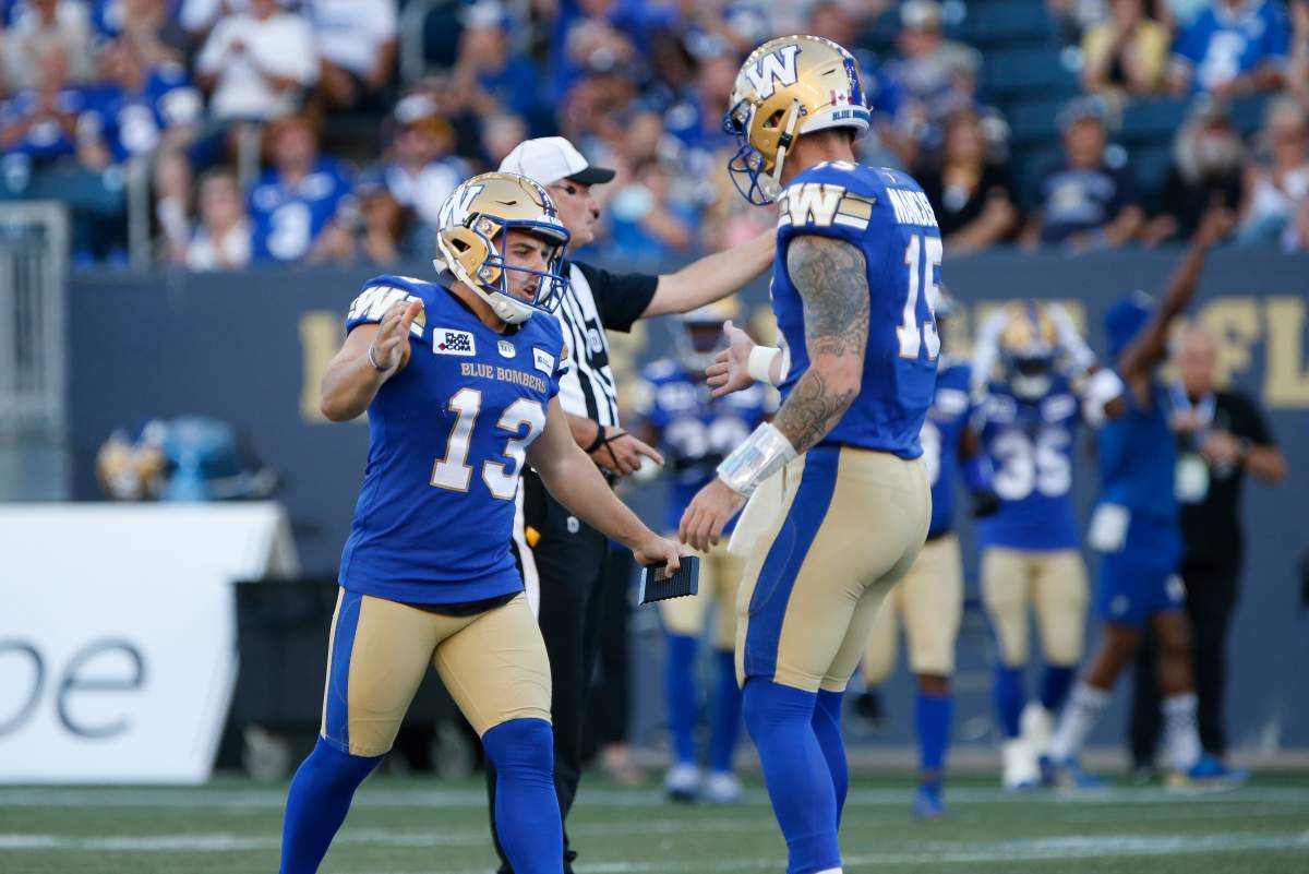 Winnipeg Blue Bombers kicker Marc Liegghio (13) celebrates his field goal against the Calgary Stampeders during the first half of CFL action in Winnipeg, Friday, July 15, 2022.