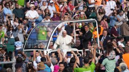 Pope Francis waves as he arrives to take part in a public mass at Commonwealth Stadium in Edmonton, Tuesday, July 26, 2022.