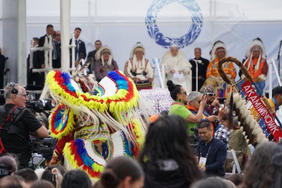 A Treaty 6 dancer performs a traditional chicken dance as Pope Francis and hosting chiefs look on at Maswacis, Alta. on Mon. July 25, 2022.