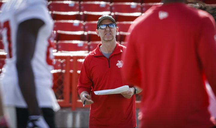 Calgary Stampeders head coach Dave Dickenson talks to players during opening day of the CFL team’s training camp in Calgary, Sunday, May 15, 2022.