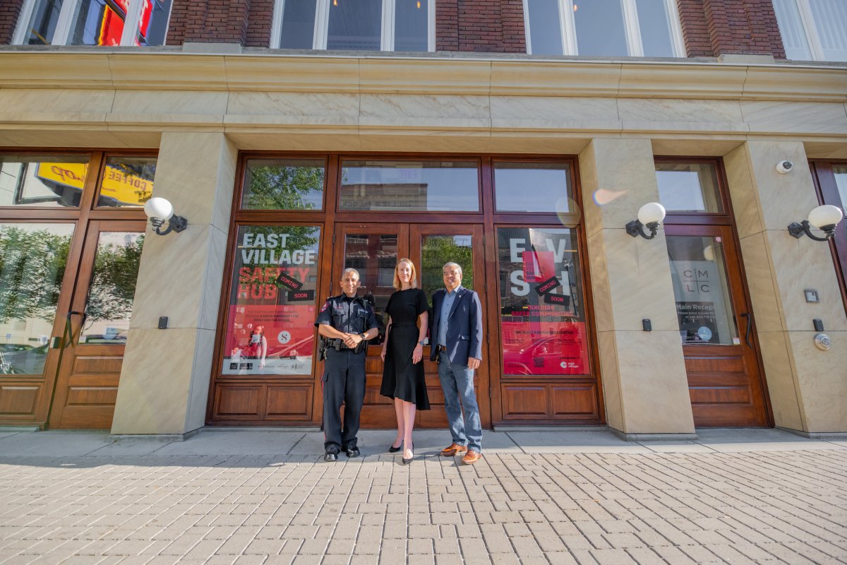 (L-R) Calgary Police Deputy Chief Chad Tawfik, CMLC’s president and CEO Kate Thompson and Ward 7 city councilor Terry Wong in front of the new East Village Safety Hub on July 28, 2022.