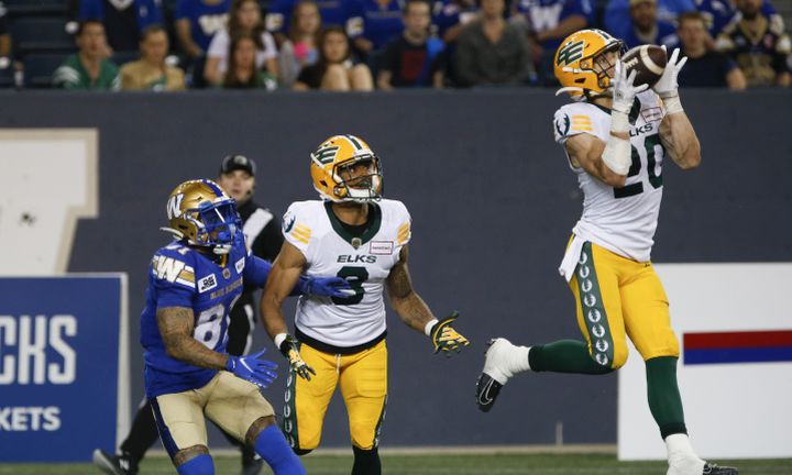 Edmonton Elks' Christian Saulsberry (20) intercepts the pass intended for Winnipeg Blue Bombers' Blake Jackson (81) during the second half of pre-season CFL action in Winnipeg, Friday, May 27, 2022. 