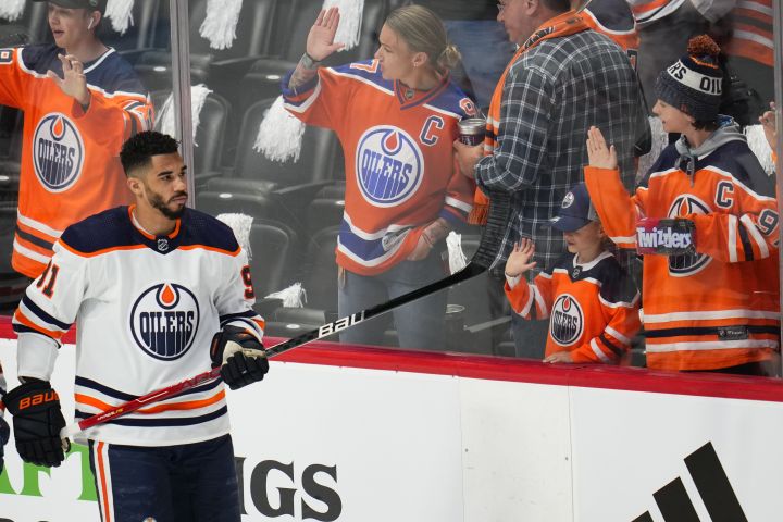 Edmonton Oilers left wing Evander Kane (91) looks at fans as players warm up for Game 2 of the NHL hockey Stanley Cup playoffs Western Conference finals between the Oilers and the Colorado Avalanche on Thursday, June 2, 2022, in Denver.