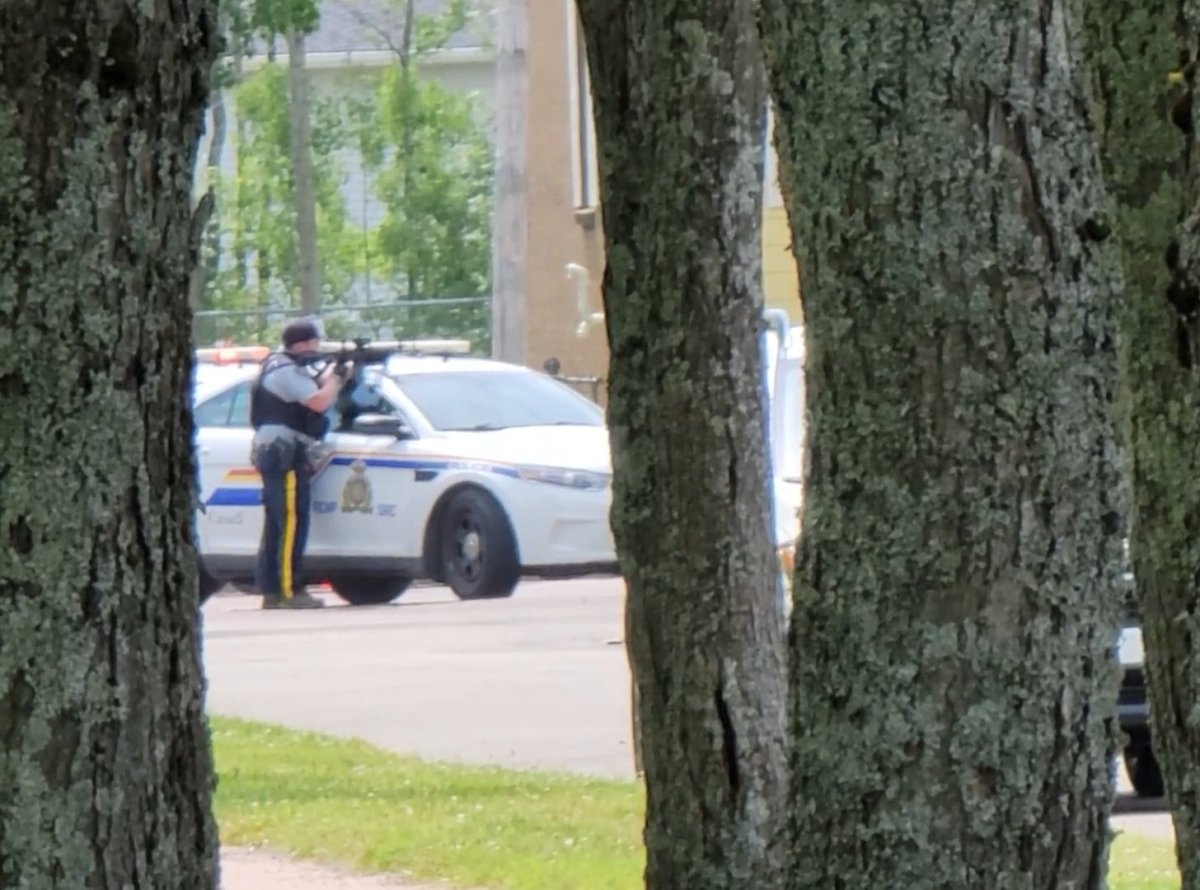 An RCMP member is seen on scene of a police operation in Moncton Sunday.
