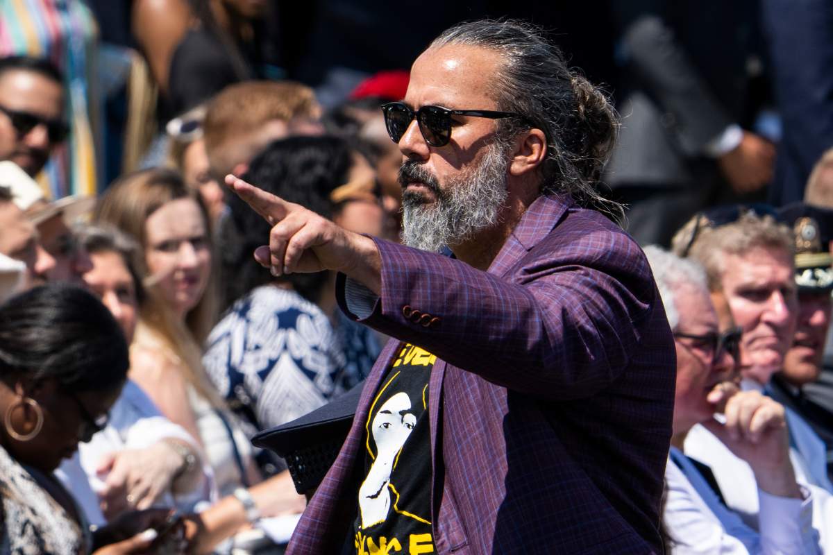 Manuel Oliver, whose son Joaquin was killed in the 2018 Marjory Stoneman Douglas High School shooting, was escorted out after interrupting remarks by President Joe Biden during an event on the South Lawn of the White House to commemorate the Bipartisan Safer Communities Act, which will help curb gun violence, on Monday, July 11, 2022.