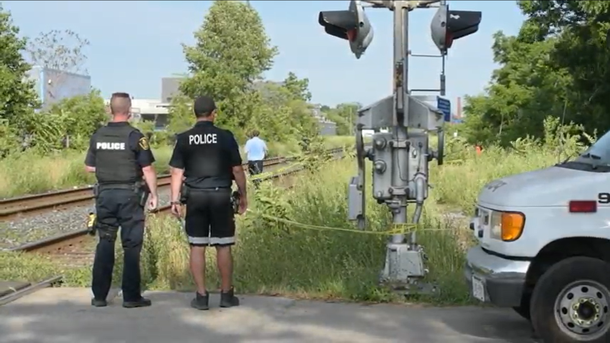 Hamilton Police say they have a 32 year old man in custody, after the body of another man was found in a tent near railway tracks in the city's east end on Monday.