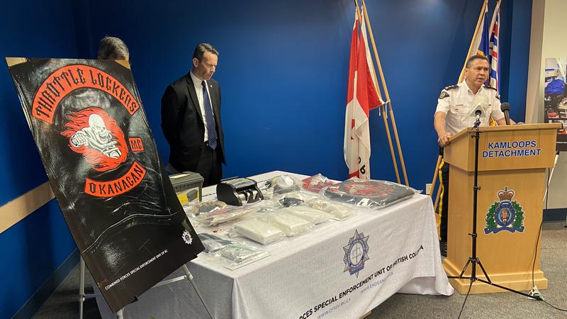 Kamloops RCMP Supt. Syd Lecky, right, and CFSEU officials show results of a 2019 seizure to media on Wednesday.