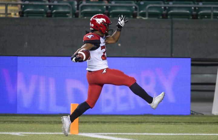 Calgary Stampeders' Peyton Logan (20) scores a touchdown against the Edmonton Elks during second half CFL action in Edmonton, Alta., on Thursday July 7, 2022. 