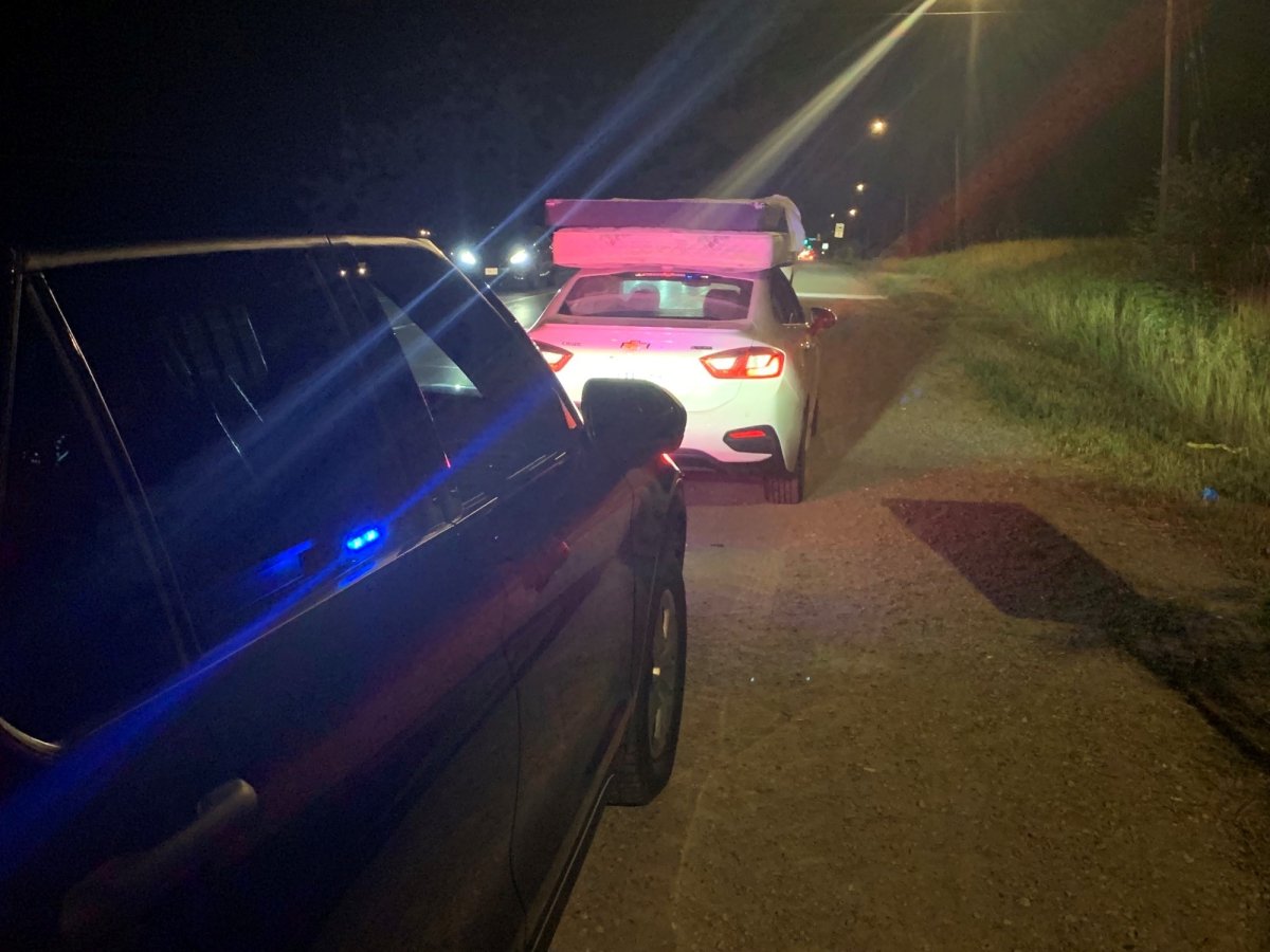 Guelph Police Service stop a vehicle transporting a mattress on the roof.