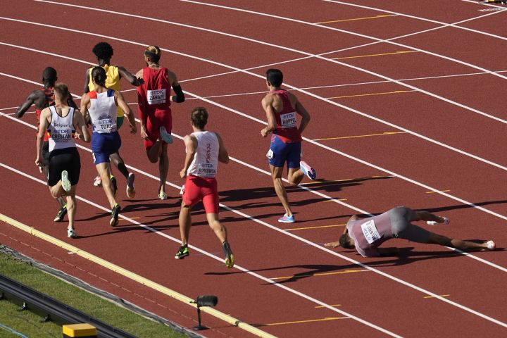 Brandon Mcbride, of Canada, falls during a heat in the men’s 800-meter run at the World Athletics Championships on Wednesday, July 20, 2022, in Eugene, Ore.