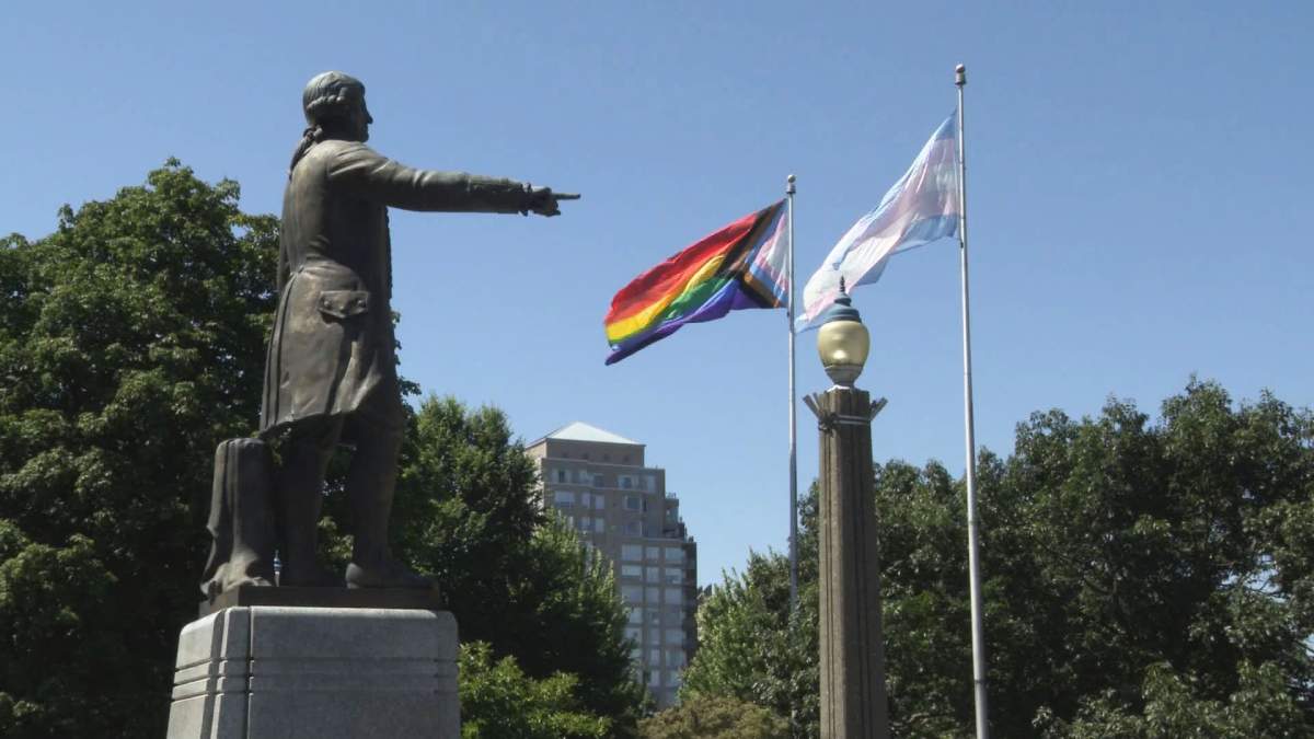 The Progress Pride and transgender flags are raised above Vancouver City Hall on July 25, 2022, to mark the beginning of Vancouver Pride Week.