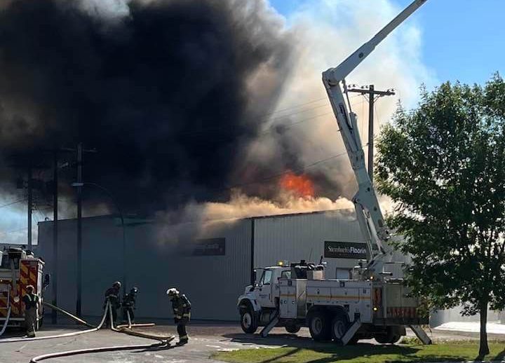 Black smoke billows from a fire in Steinbach.