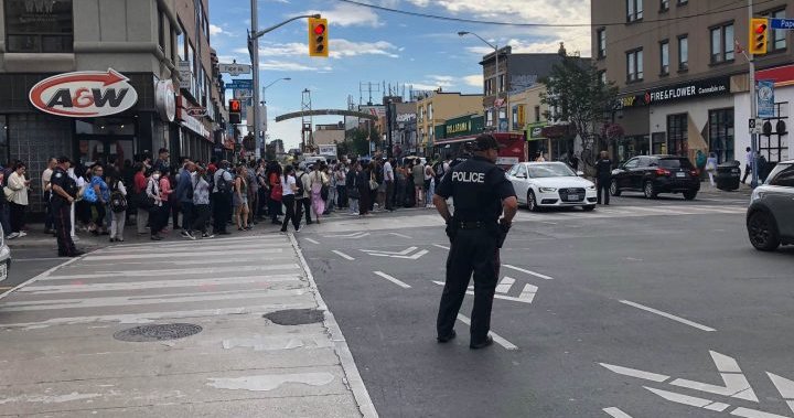 Crowds spill into traffic as TTC shuts down part of subway line due to fire
