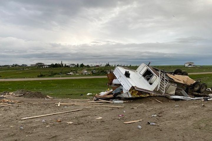 A trailer, vehicles and a home under construction were all damaged on the same property just outside Medicine Hat, Alta., on July 18, 2022 after a powerful storm tore through the area.