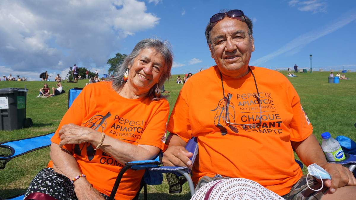 Norman Kistabish and his wife Emily Mowatt Kistabish sit on the Plains of Abraham in Quebec City on Wed. July 27, 2022, waiting for Pope Francis to arrive.