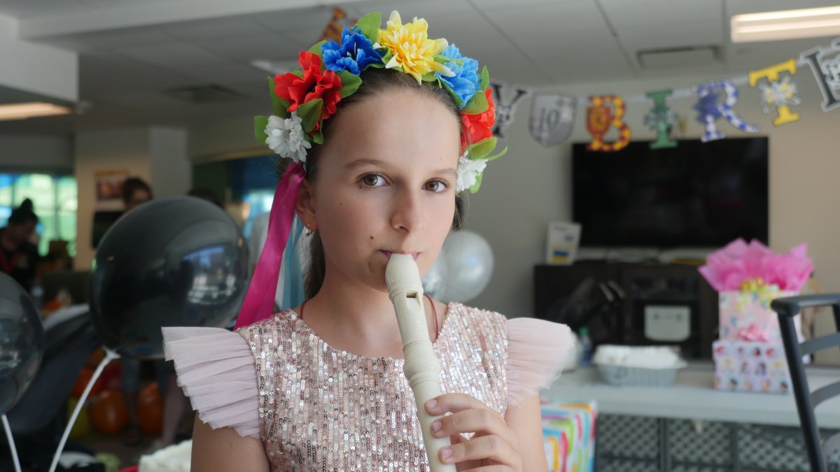 Sofiia Oleksandr playing her recorder