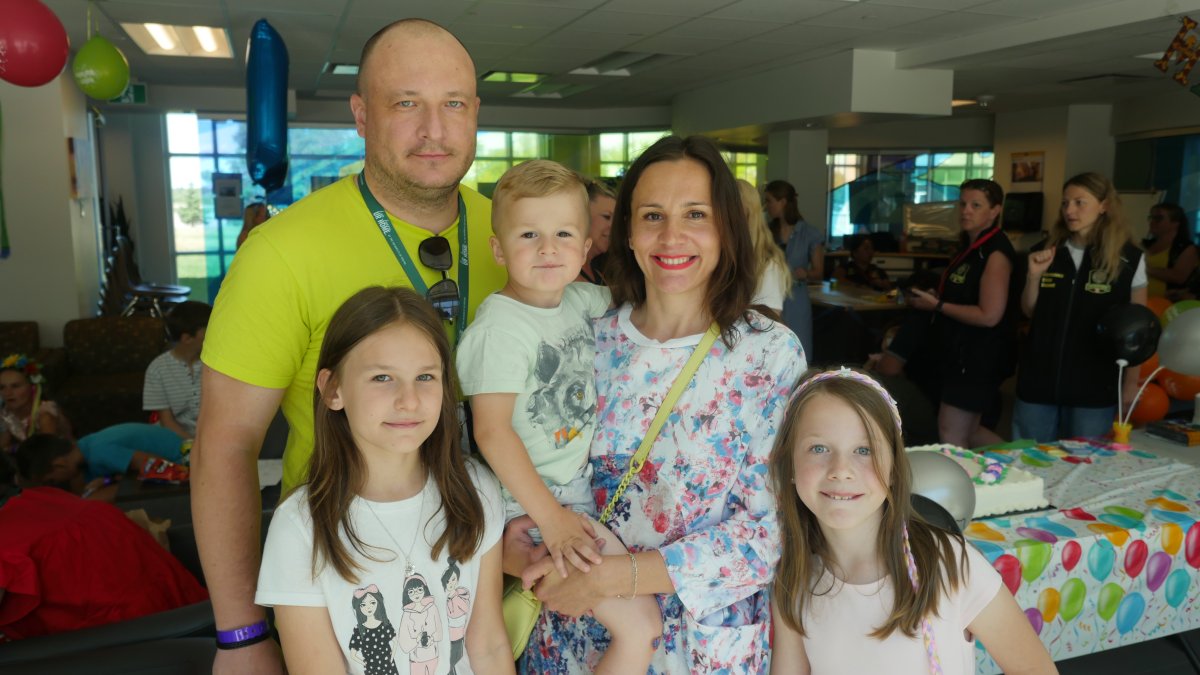 Serhii Storozhenko with his wife Olena and their children