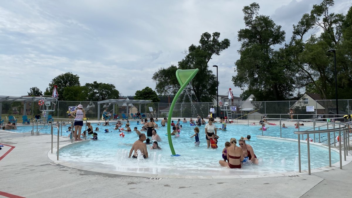 Hamiltonians gather in the Parkdale outdoor pool, which reopened on Wednesday after a year and a half of renovation work.