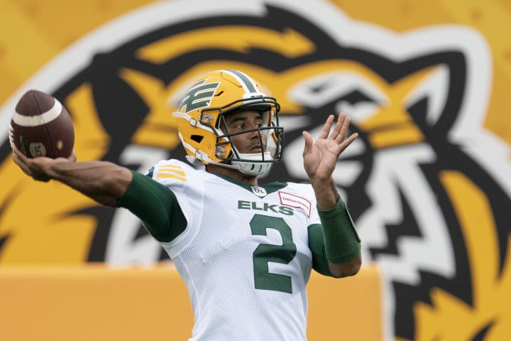 Edmonton Elks quarterback Tre Ford (2) throws during warm up prior to CFL football game action against the Hamilton Tiger Cats in Hamilton, Ont., Friday, July 1, 2022. 