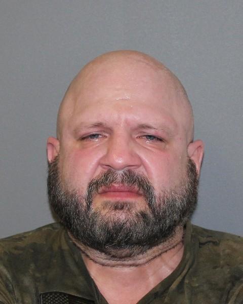 Pictured is 47-year old Michael Hans Bopfinger who is wanted for assault, uttering threats and a number of firearms related offences.