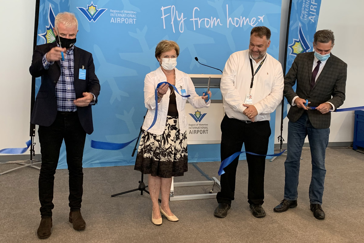 From left to right: Stephen Jones, CEO of Flair Airlines, Regional Chair Karen Redman, Chris Wood, general manager of Waterloo International Airport and MP Tim Louis cut the ceremonial ribbon.