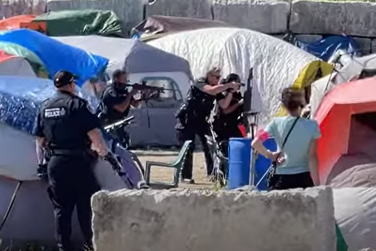 A video has been posted to YouTube that shows Waterloo Regional Police officers with guns drawn at a homeless tent encampment in Kitchener as they responded to a gun call.