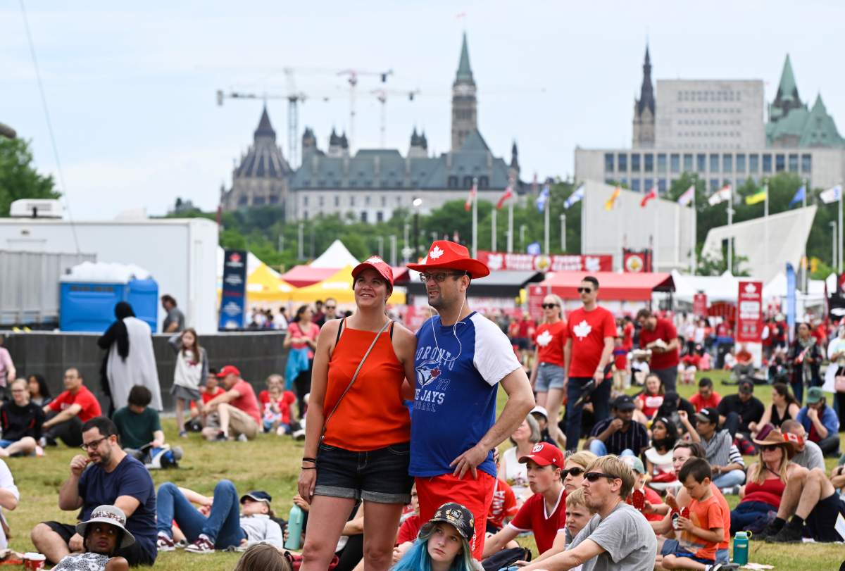 People wait for the Canada Day concert to get started at LeBreton Flats.