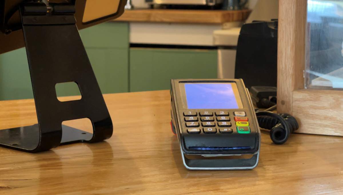 Cafe manager Micah Hiltz says one-third of the shops patrons usually pay by debit.