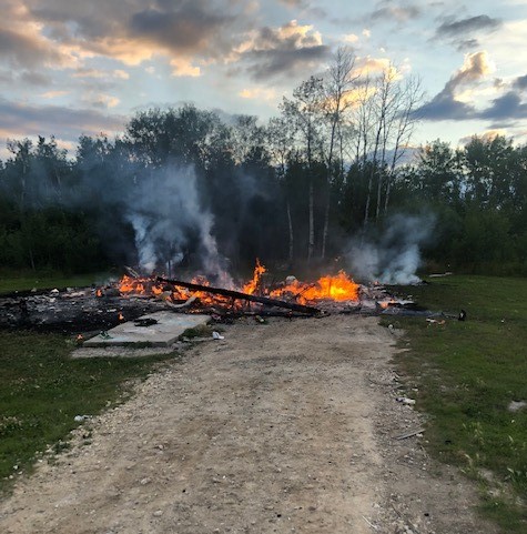 RCMP say arson and assault charges have been laid after fire burned a home to the ground in Black River First Nation Saturday.