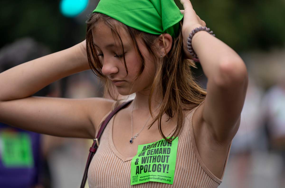 An abortion rights protester in the U.S. wears green