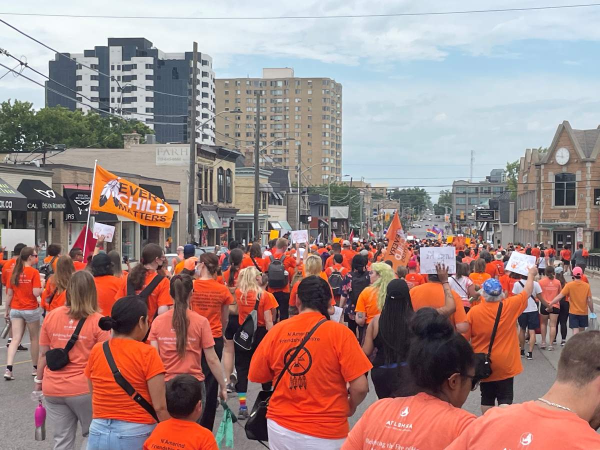 A crowd of Indigenous peoples and allies making their way down Richmond Street for the 2022 Turtle Island Healing Walk.