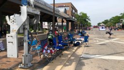 Empty chairs line a street in Highland Park, Illinois, where a shooting took place on the Fourth of July.
