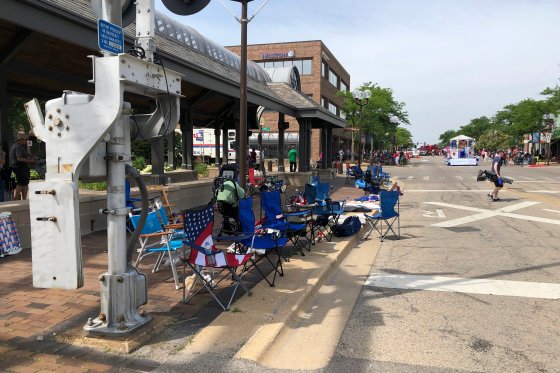 Empty chairs line a street in Highland Park, Illinois, where a shooting took place on the Fourth of July.