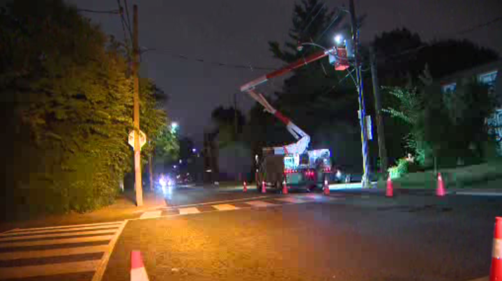 A hydro crew works to restore power in a Toronto neighbourhood late Sunday.