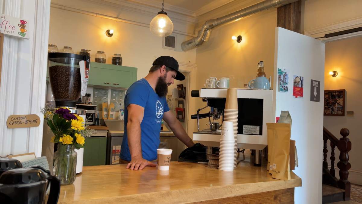 Cafe manager Micah Hiltz says one-third of the shops patrons usually pay by debit.