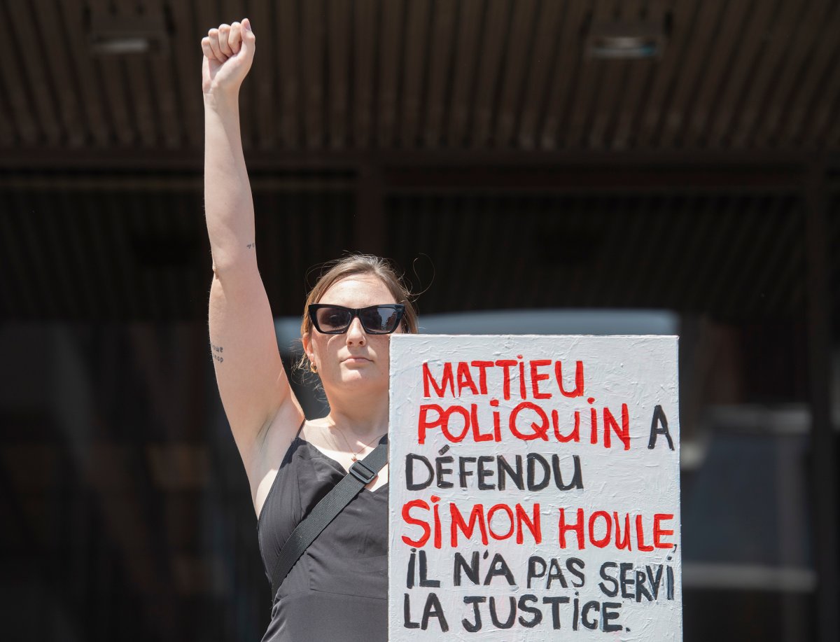 A woman takes part in a protest against a decision by judge Matthieu Poliquin in the case against a man who pleaded guilty to sexual assault and voyeurism in Montreal, Sunday, July 10, 2022.