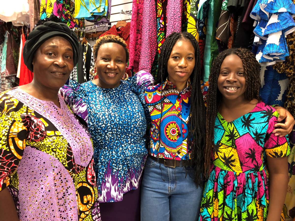 Huzainatu Bangura (second to left) and her family pose for a photo in their store in Jane Finch Mall called Fab Boutique