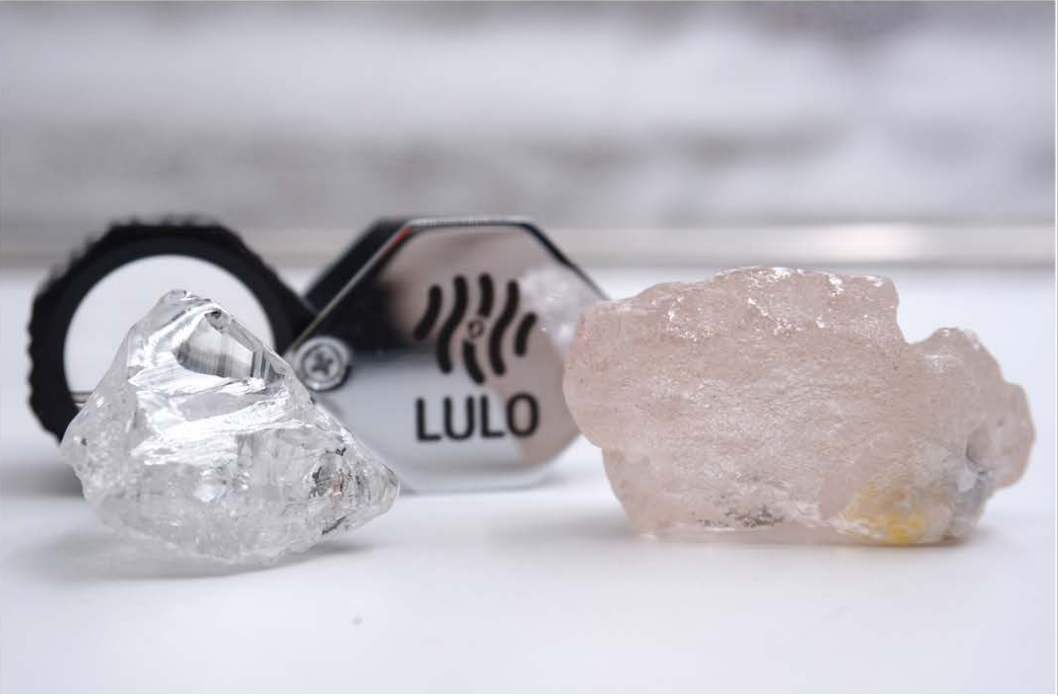 The pink Lulo Rose diamond positioned beside another clear coloured diamond.