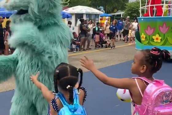 Two young Black girls appeared to be ignored by the character Rosita during a Sesame Place parade.
